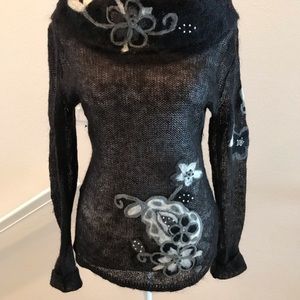 European made long sleeve knit turtleneck sweater. Size medium.